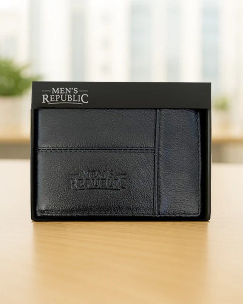 Black leather wallet with 'Men's Republic' branding on a wooden surface.