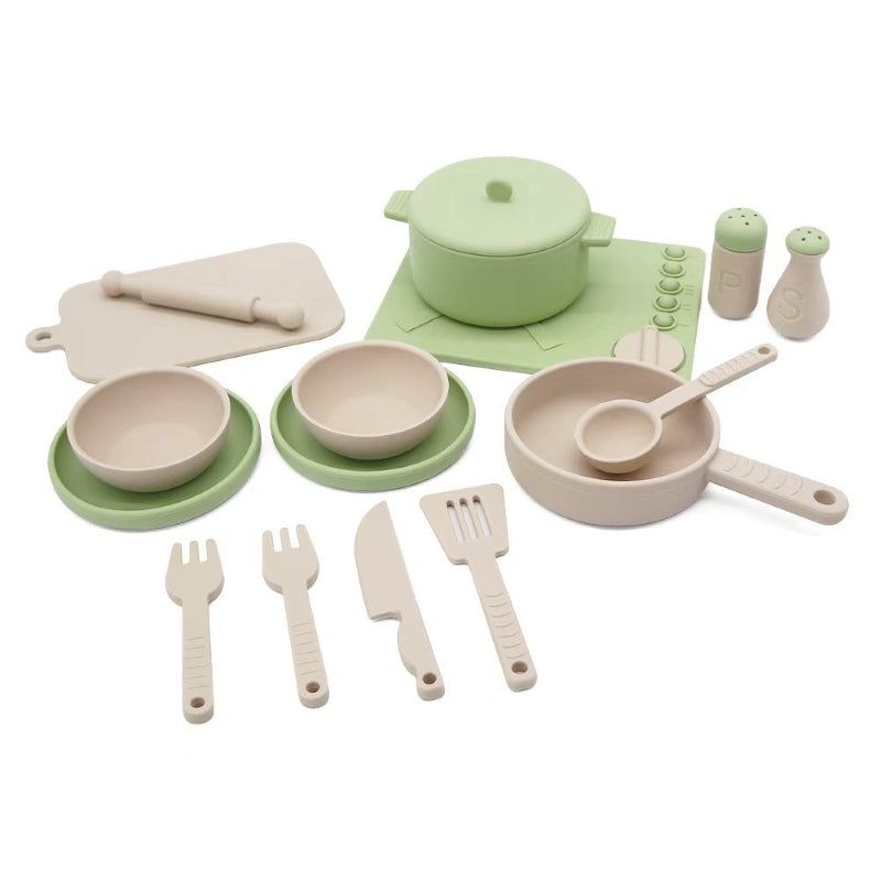 Set of green and beige toy kitchen utensils and cookware on a white background